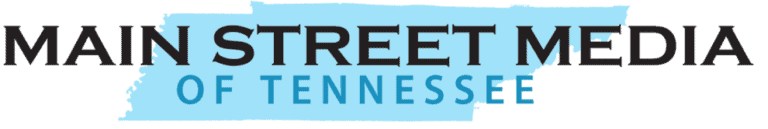 Main Street Media of Tennessee logo with bold black and light blue text over a blue brushstroke background.