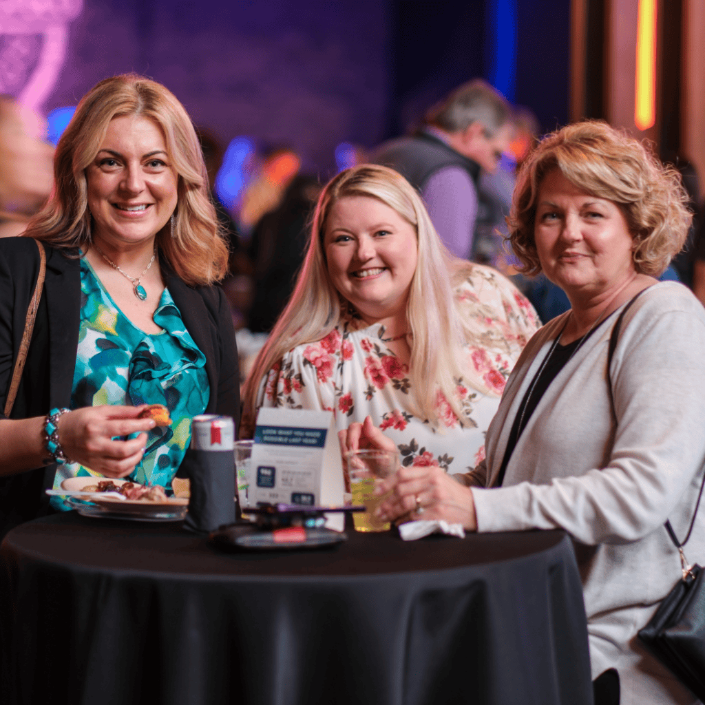 Three women at a fundraiser event