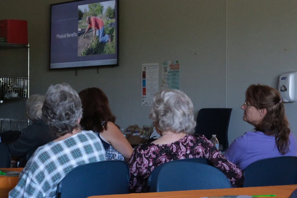 Three community seniors learning how Agriculture and Food Security are related at Second Harvest's Project Grow Educational Series.