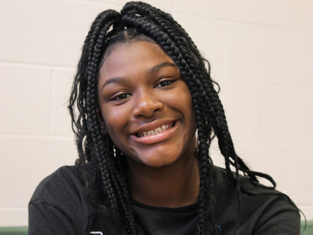 Smiling girl at an afterschool program supported by Second Harvest, which helps provide summer meals for kids.