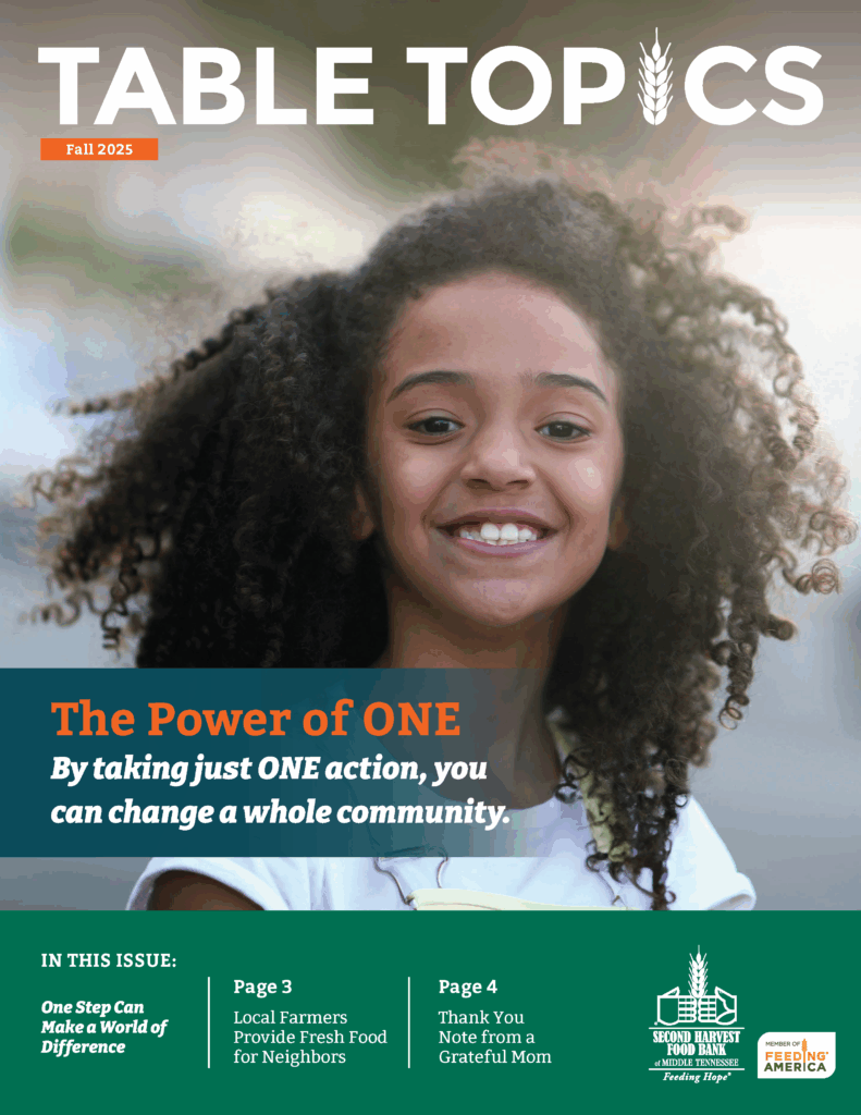 A smiling girl with curly hair stands outdoors on the cover of a magazine titled Table Topics, featuring the headline, The Power of ONE: By taking just ONE action, you can change a whole community.