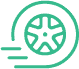 A simple green icon of a spinning car wheel with three motion lines to the left, suggesting movement or speed.