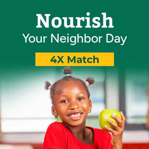 A smiling young girl in a red shirt holds a green apple. Above her, text reads Nourish Your Neighbor Day and 4X Match on a yellow background.